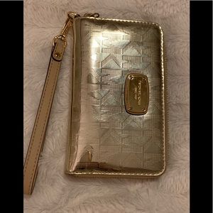 Micheal kors golden color wristlet/ wallet